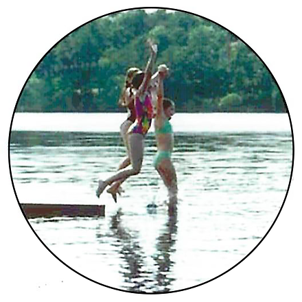 A group of children enjoy a summer day by swimming in the pond, one of many activities offered at Camp Wingate Kirkland
