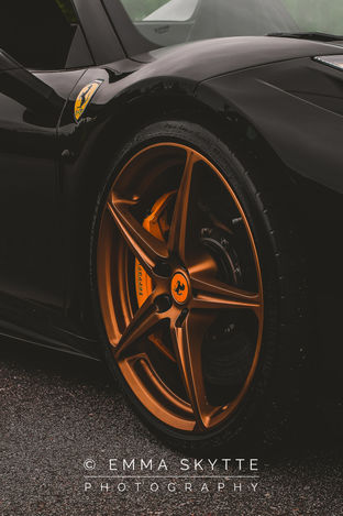 Black Ferrari 458 car with golden rims