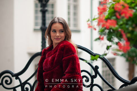 Fashion photo shoot with red faux fur jacket