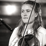 Photo of bandmember Emma Ware playing fiddle