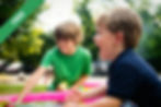 A boy shouting near another boy