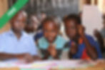 A group of young children sitting at a table