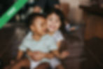 A girl hugging a boy