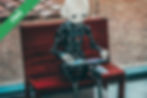 A black and white robot toy on a red table