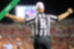 A referee in a striped uniform