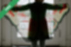 A girl in a plaid jacket standing on a tiled floor