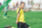 A boy kicking a football
