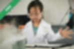 A girl in a lab coat and goggles