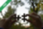 A person holding two pieces of a puzzle