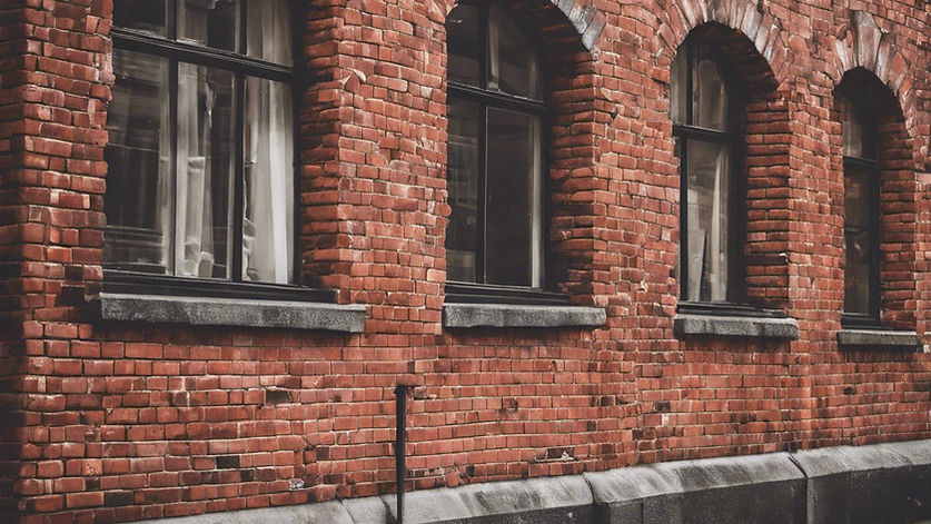 red bricks on an old building in a city.jpg