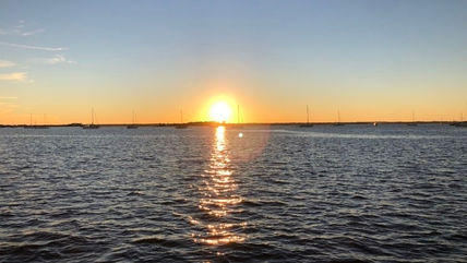 Enjoy beautiful sunsets while cruising the Intercoastal Waterway (ICW) on Follow That Dream
