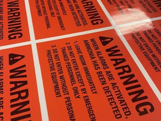 Printed orange safety warning decals printed by Plain Insane Graphix