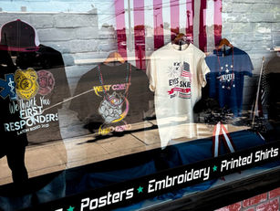 Patriotic t-shirts and VFA t-shirts in front window at Plain Insane Graphix in Lemoore