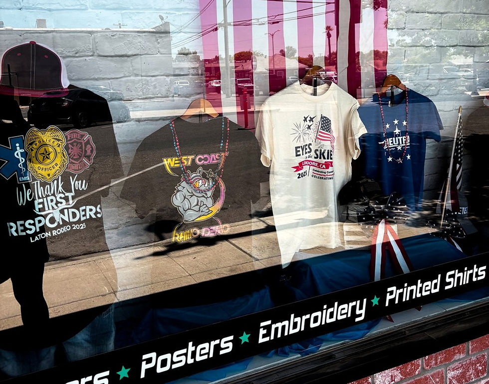 Patriotic t-shirts and VFA t-shirts in front window at Plain Insane Graphix in Lemoore