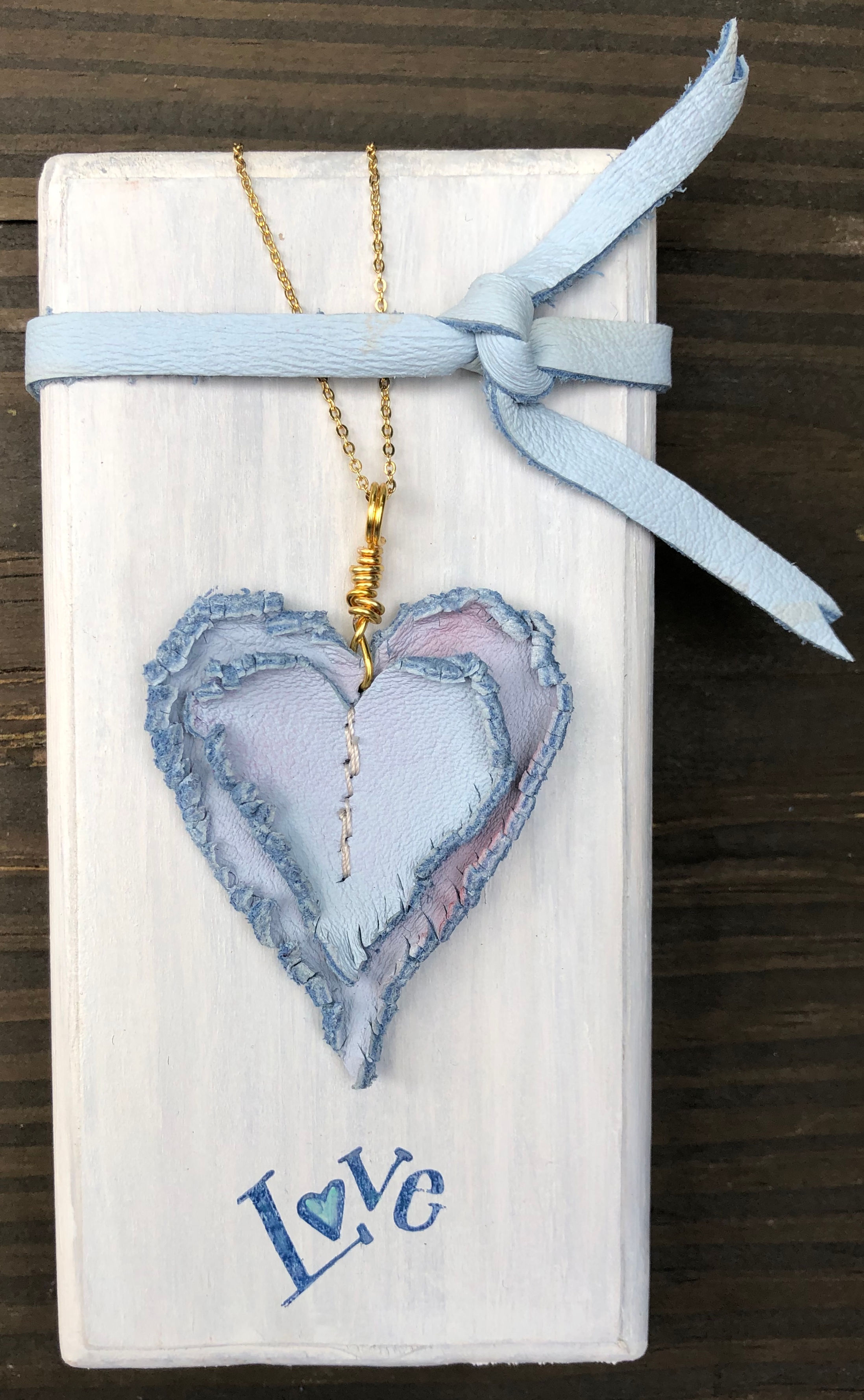 Blue on Blue Leather Heart Necklace with Gold Wire and Chain on LOVE Block