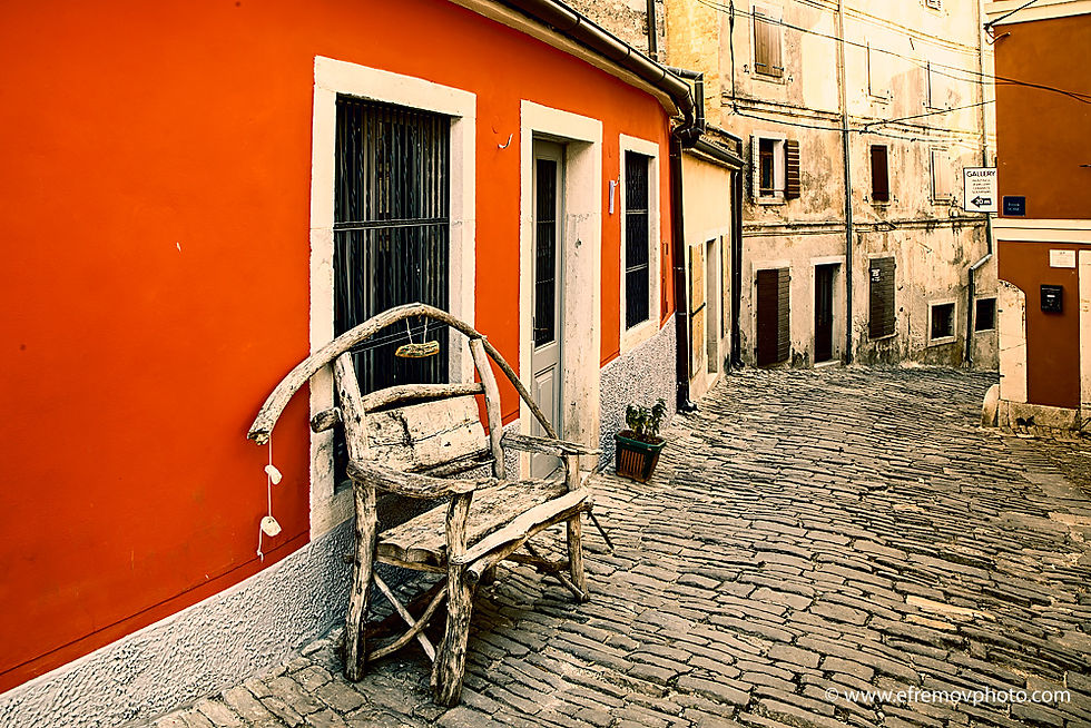 A bench by the red wall