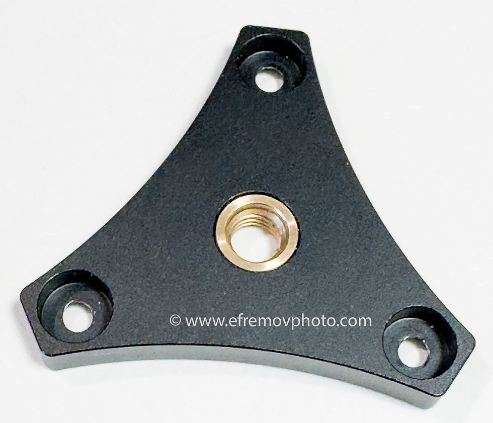 LP-64. Leveling base. Tripod head. Black triangular metal mounting plate with brass threaded insert and three holes on white background; watermark www.efremovphoto.com