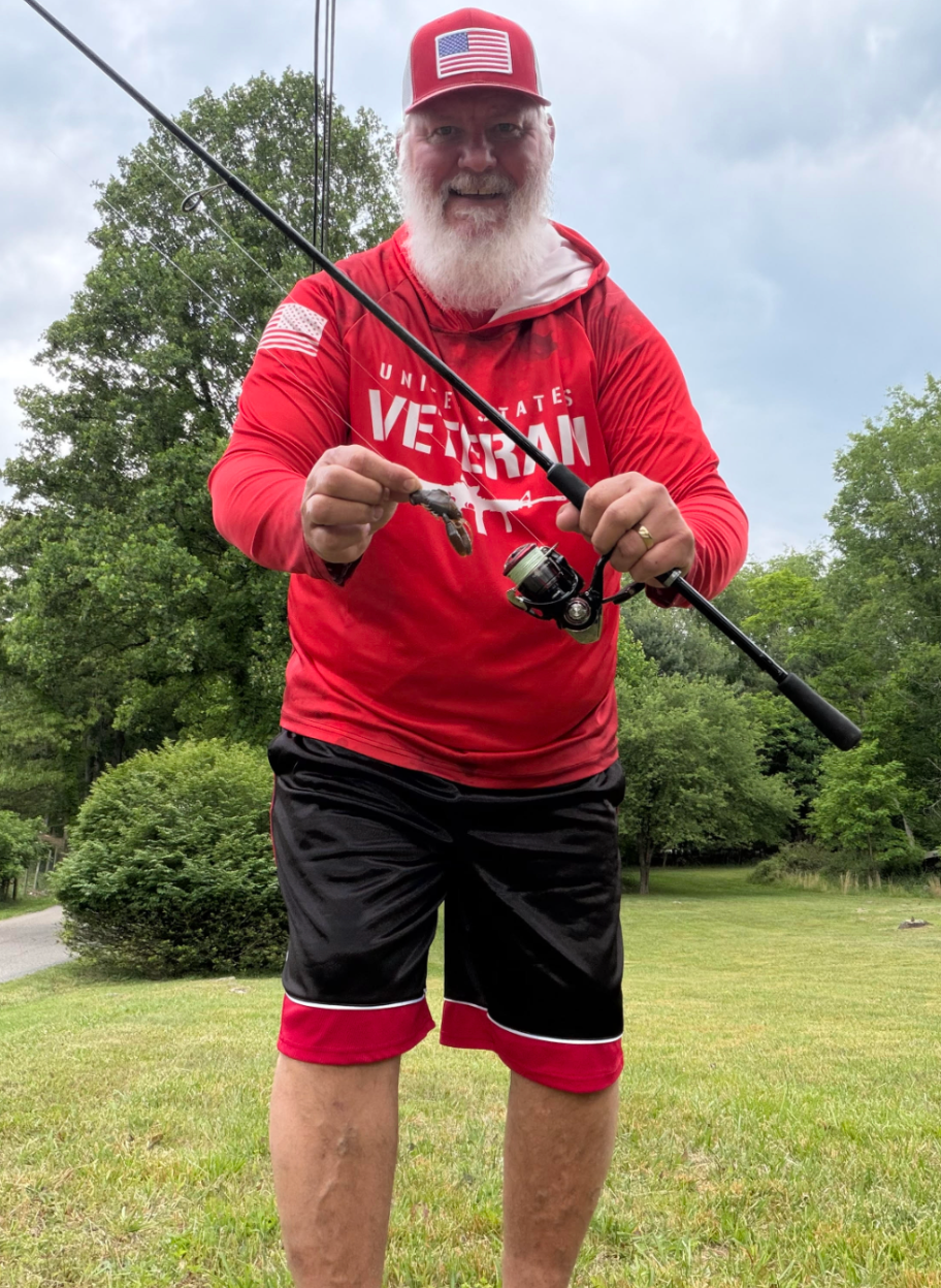 Allison with his Diawa TATULA XT701MHFS spinning rod paired with the Diawa Feugo 2500 spinning reel and the top bait he used which was a Mega Bass Sleeper Craw in Numa Ebi color.