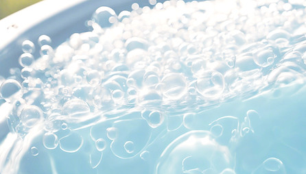 close up of bubbles from water in a hot