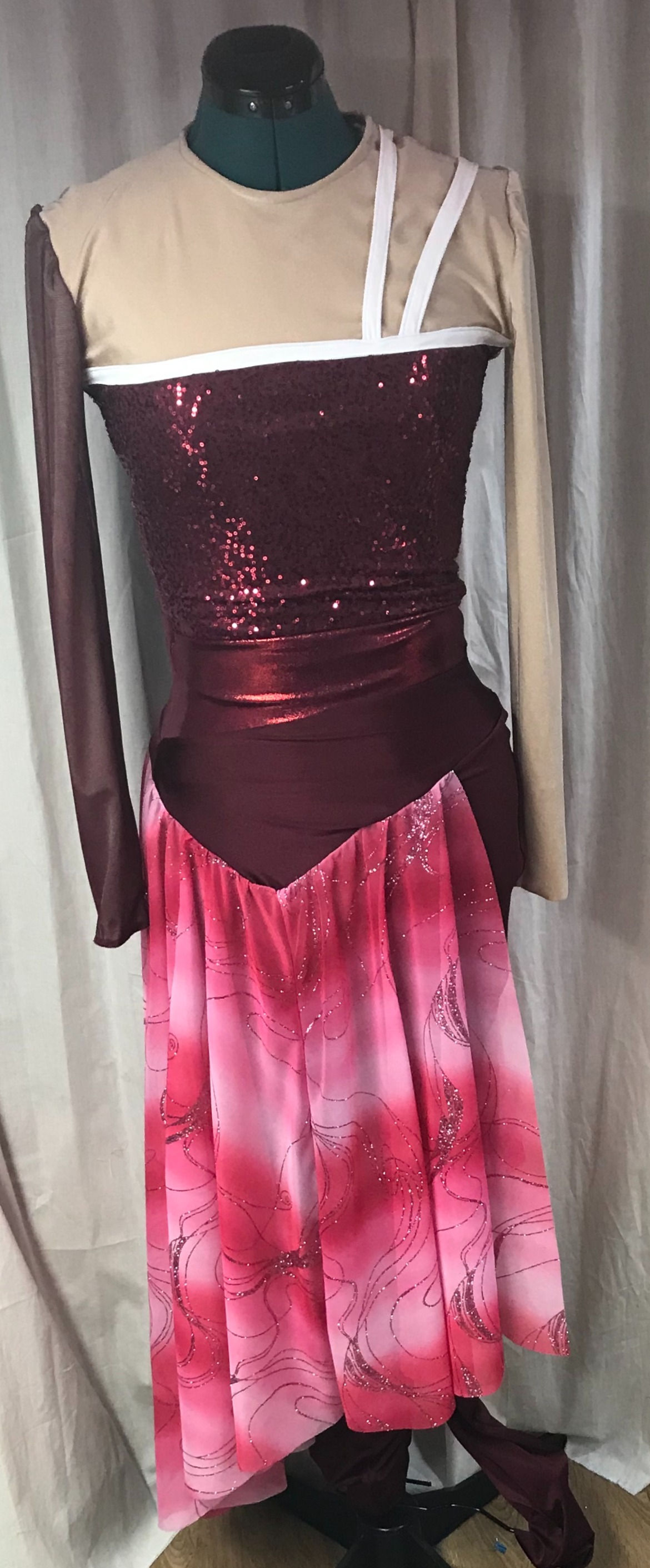 ONE PIECE JUMPSUIT WITH ATTACHED ANGLED SKIRT