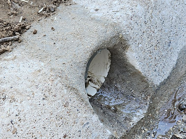 Drain pipe passing through curb