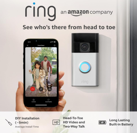 Hand holding phone showing Ring app with a family by the door. Doorbell camera on wall. Text: DIY Install, HD Video, Long Battery.