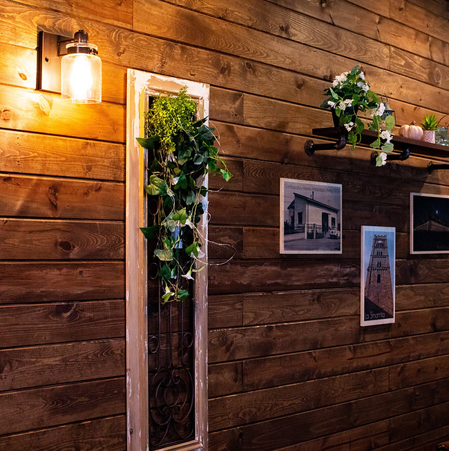 Cozy Frisco restaurant interior with wooden walls and warm lighting