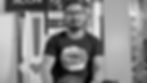 Man wearing glasses and acona shirt
