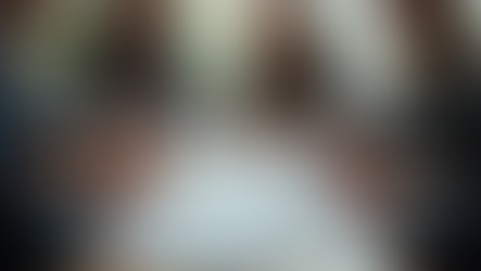 Eye-level view of a creative team brainstorming ideas around a table