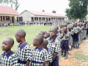 Pupils at Better Days Primary School lining up in the school compound.