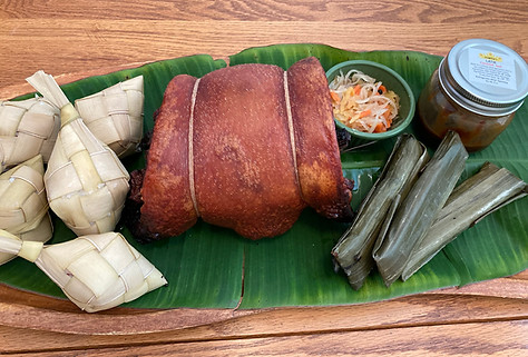 an image of puso with cebu lechon belly and other sides