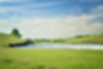 A stock image of hills and a lake in South Dakota.