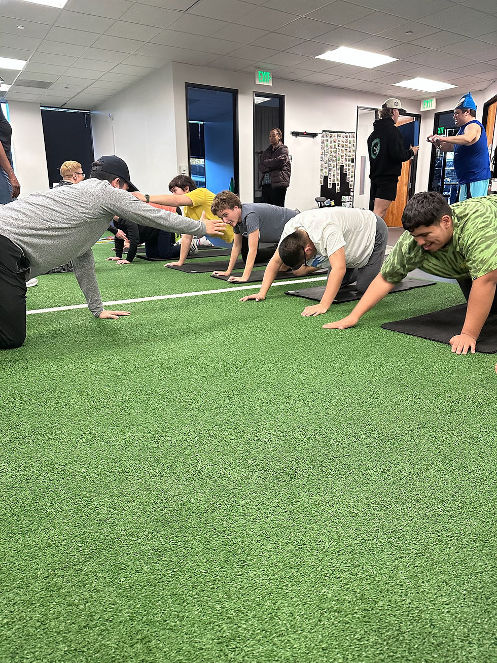 Working on abs and core during a teen circuit class.