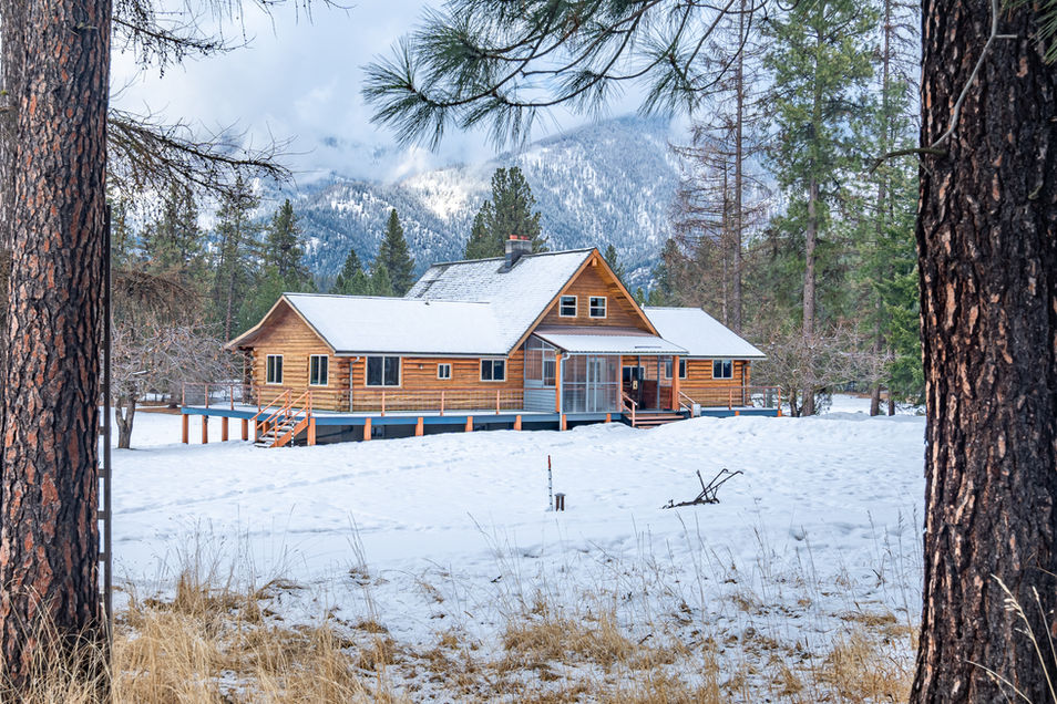 Snow-covered grounds surround this Montana guest ranch, ideal for family-friendly vacations and nature escapes. With panoramic views of the winter landscape, this dude ranch offers an authentic Montana ranch experience.