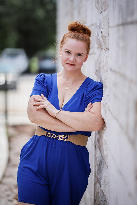 Tammara leaning on wall