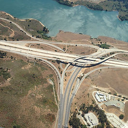 Three methods for assessing the impact of new transport infrastructure Transport infrastructure is a powerful driver of economic and social change. Governments and planners need reliable methods to assess the likely impacts of major investments in roads, rail, and public transport. Several analytical tools exist for this purpose, each with their own strengths, limitations, and levels of complexity. This article focuses on three key methods: Gross Value Added (GVA) analysis, Computable General Equilibrium (CGE) modelling, and Cost-Benefit Analysis (CBA), while also exploring emerging opportunities to integrate new data sources and artificial intelligence (AI). Traditional GVA-based approaches Gross Value Added (GVA) analysis estimates the economic output generated by a transport investment. Typically, this is calculated by assessing the expected increases in employment, productivity, and activity in affected sectors or regions. GVA estimates are often derived from observed correlations between accessibility improvements and economic indicators. This method is particularly popular because it produces concrete numbers that can be directly tied to GDP and employment. It is intuitive and policy-relevant, especially for politicians and decision-makers seeking tangible economic returns. However, GVA-based assessments face key limitations: Causality vs correlation : They often rely on before-and-after comparisons or modelling based on assumed elasticities, which do not always prove a direct causal link. Double counting : There is a risk of overlap with other measures like travel time savings, leading to inflated estimates. Exclusion of distributional impacts : These methods rarely distinguish between who gains and who loses across sectors and regions. GVA methods are useful in providing headline indicators but should be complemented with more nuanced analysis to guide infrastructure planning. Cost-benefit analysis (CBA) Cost-benefit analysis (CBA) is a long-standing and widely used method that compares the total expected costs and benefits of a project over its lifetime. It aims to determine whether the benefits to society exceed the costs of construction, maintenance, and operation. When applied rigorously, it offers a structured and transparent framework for project evaluation. Key elements of transport CBA include: User benefits : Primarily travel time savings, vehicle operating cost reductions, and improved safety. Reliability and environmental impacts : Increasingly, CBAs account for travel-time reliability and emissions reductions. Monetary valuation : Non-market impacts, such as noise and greenhouse gas emissions, are monetised using shadow pricing or revealed preferences. Despite its widespread use, CBA has faced criticism, particularly in the context of large transport projects. Key challenges include: Mismatch with political priorities : CBA typically evaluates national welfare but may not address political concerns about jobs, local development, or regional equity. Scope limitations : Standard CBA often omits wider economic impacts such as agglomeration or land use changes due to modelling constraints. Static assumptions : It rarely captures dynamic changes in behaviour, such as the relocation of households or businesses, over time. Efforts are under way to improve CBA’s scope and quality. Recent guidance encourages the inclusion of reliability benefits, agglomeration effects, and labour supply responses when robust evidence is available. These enhancements provide a more comprehensive view of value without losing the discipline of the underlying framework. When assessing transformational or spatially significant projects (e.g., urban regeneration), wider economic impacts become more important. In these cases, scenario analysis can complement CBA by illustrating potential outcomes under different assumptions. In the future, integrated models may improve the ability to predict these changes, but for now, a modular and transparent approach—CBA plus complementary evidence—is generally preferred. Ultimately, CBA should inform but not dominate decision making. It is most useful when it is aligned with policy objectives, draws on high-quality local data, and is integrated into a broader multi-criteria assessment framework. Computable general equilibrium (CGE) modelling CGE models simulate the entire economy’s response to a transport investment by accounting for interlinkages between sectors, households, and government. They estimate how changes in travel costs influence wages, prices, employment, and production across regions and industries. The advantages of CGE models include: Capturing indirect and long-term effects : They can show how transport affects land use, productivity, and sectoral growth. Consistent with economic theory : CGE models use a system of equations grounded in microeconomic behaviour and market interactions. Scenario flexibility : They are well suited for testing the economic effects of different investment options and policy changes. However, CGE modelling is data-intensive, complex, and difficult to validate. Key criticisms include: Sensitivity to assumptions : Results depend heavily on the chosen elasticities and input-output tables. Transparency and replicability : The models are often seen as ‘black boxes’ to non-specialists. Implementation barriers : High expertise and computing resources are required. Despite these limitations, CGE models offer valuable insights when used alongside other tools. For example, they can contextualise the results of a CBA by illustrating broader economic dynamics. Dynamic and data-driven assessments Traditional models are increasingly being enhanced or challenged by new sources of data and technology. Real-time transport data, mobile location tracking, and AI-driven analysis can provide granular insights into travel behaviour and land-use interactions. These developments offer several opportunities: Better calibration : Models can be improved using high-frequency observed data. Behavioural insights : AI can detect patterns in traveller responses to delays, pricing, or service changes. Scenario forecasting : Machine learning can support more flexible and adaptive planning by identifying trends not captured by fixed parameter models. These methods are still evolving, and while promising, they face hurdles including privacy concerns, data interoperability, and institutional capacity. However, their integration into traditional models can lead to more timely, transparent, and inclusive decision-making. Conclusion No single method perfectly captures all the impacts of a transport investment. GVA methods are accessible but limited in depth. CBA remains the cornerstone of project appraisal, offering transparency and rigour, but it must be applied carefully and supplemented where needed. CGE models provide a broader view of economic changes but come with high complexity. As technology evolves, integrating AI and real-time data into modelling can improve the precision and responsiveness of infrastructure assessments. Ultimately, effective planning will depend on a balanced approach that blends technical robustness with policy relevance, ensuring that transport decisions deliver both economic efficiency and social value.