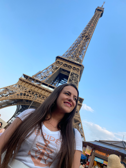 Woman in 'Bride' shirt near Eiffel Tower