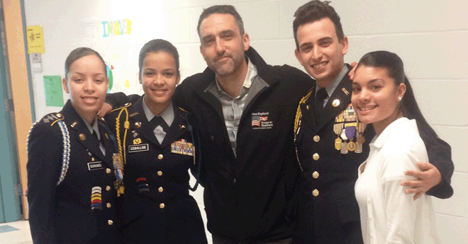 Josh Tarsky teacher with a group of JROTC high schoolers