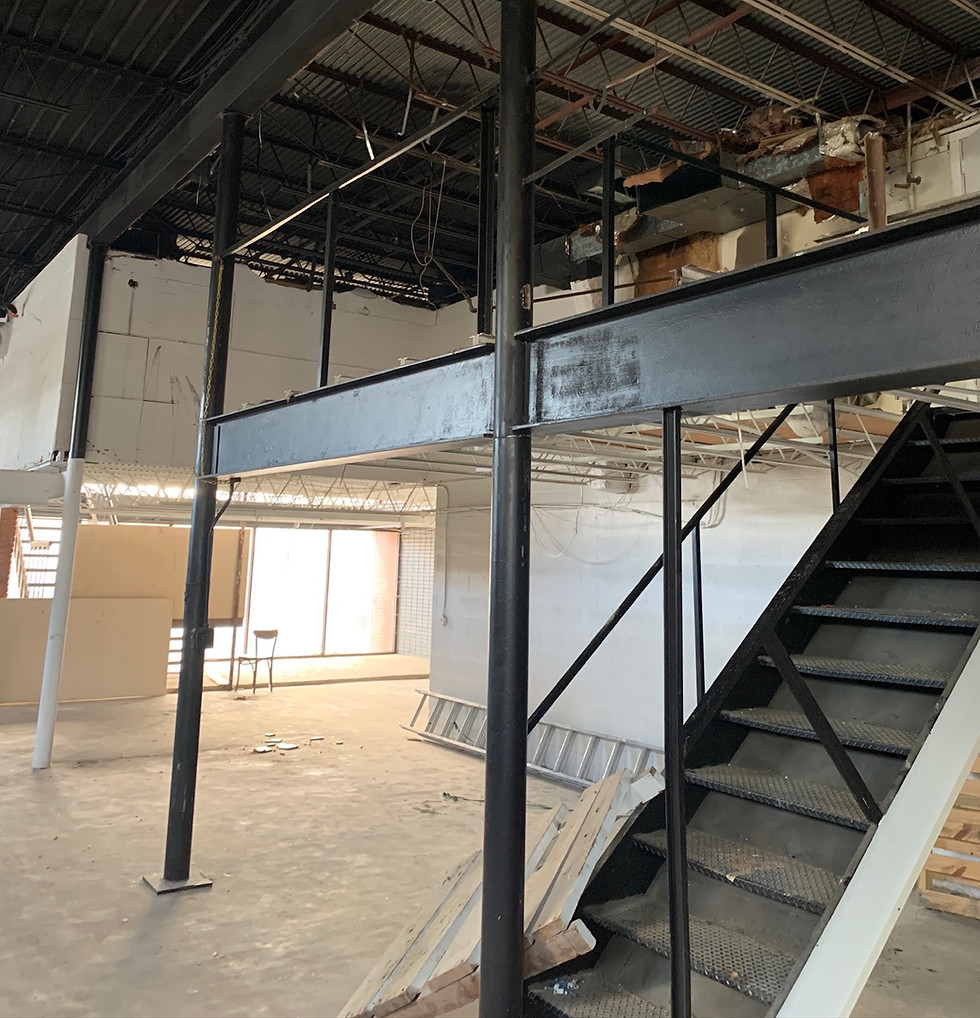 Existing commercial space documented prior to demolition and engineered structural steel additions, capturing the original conditions before a complete architectural renovation.