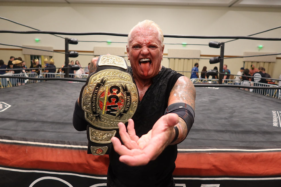 Gangrel poses with the CCW World Heavyweight Championship