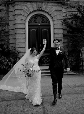 wedding couple embracing leaving the Kingwood Center Gardens