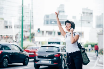 A woman is calling a taxi from Executive Cabs Glasgow by phone number