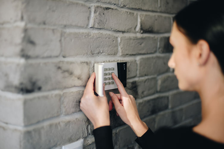 Woman entering code on keypad - paid for istock image.jpg