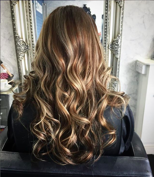 blended balayage with contrasting blonde and brunette tones to add dimensional colour by hair expert