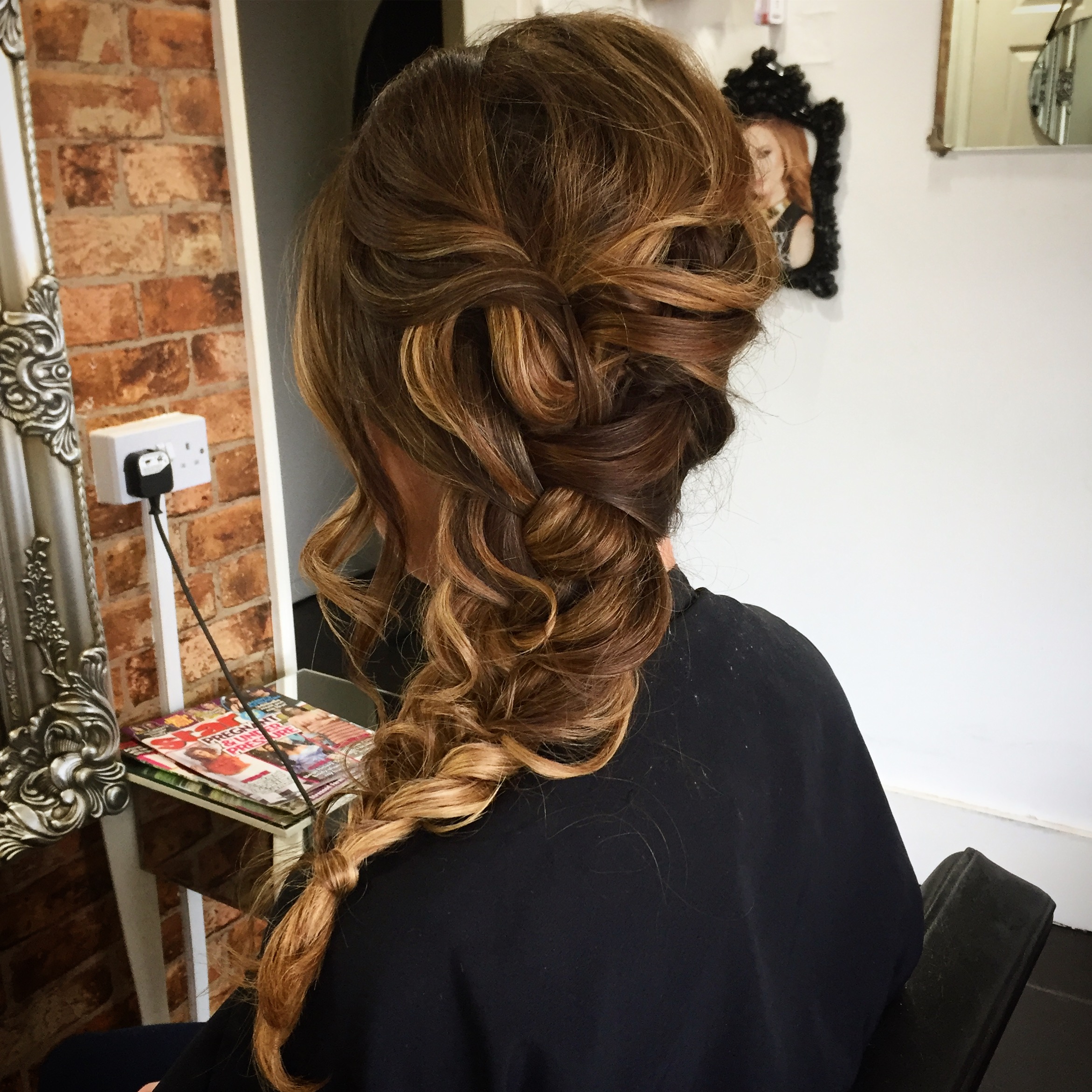 plaited loose hair up created by wedding hair specialist on balayage hair