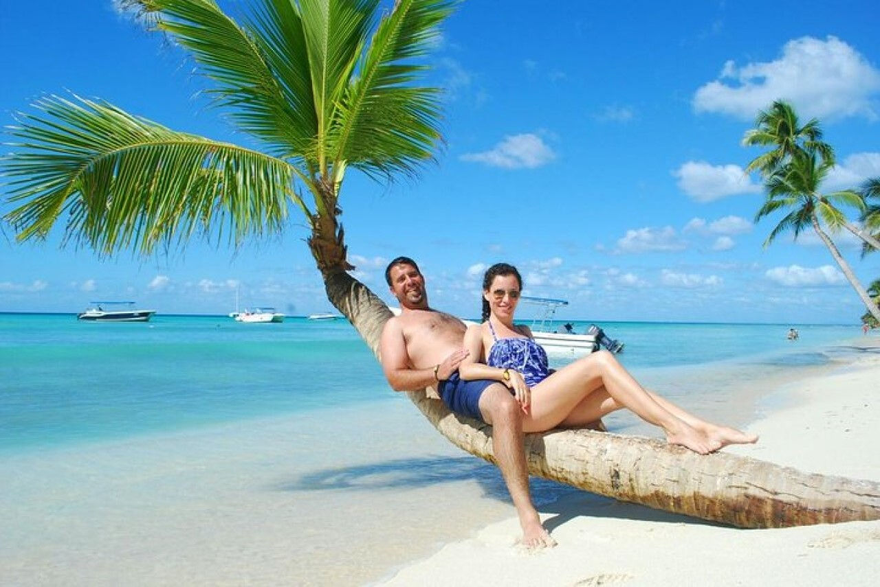 Couple posing for a picture on the beach of Saona Island in the Dominican Republic