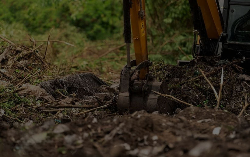 Machinery Arm digging into the ground
