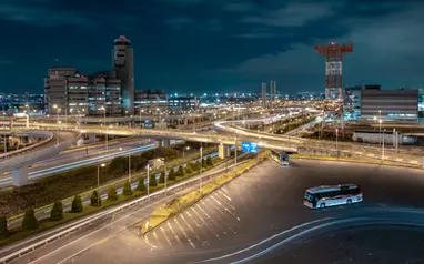 Night view of Haneda Airport with expressways and traffic light trails