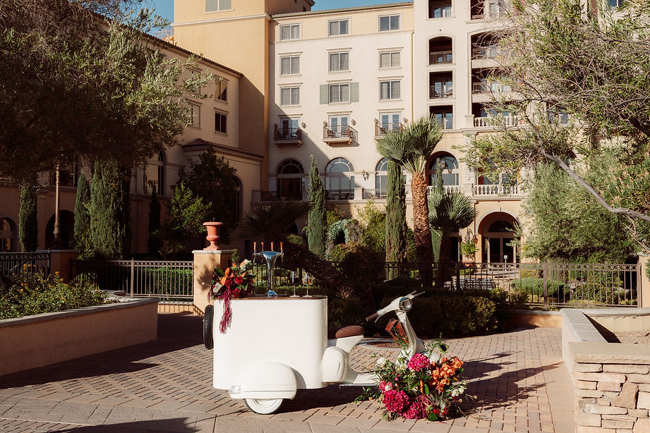 Luxury Vespa mobile tap bar surrounded by lush florals for an event in Las Vegas