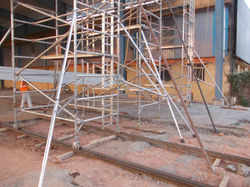 Using Scaffolds for roofing work with wheels in rails for fast movement 2